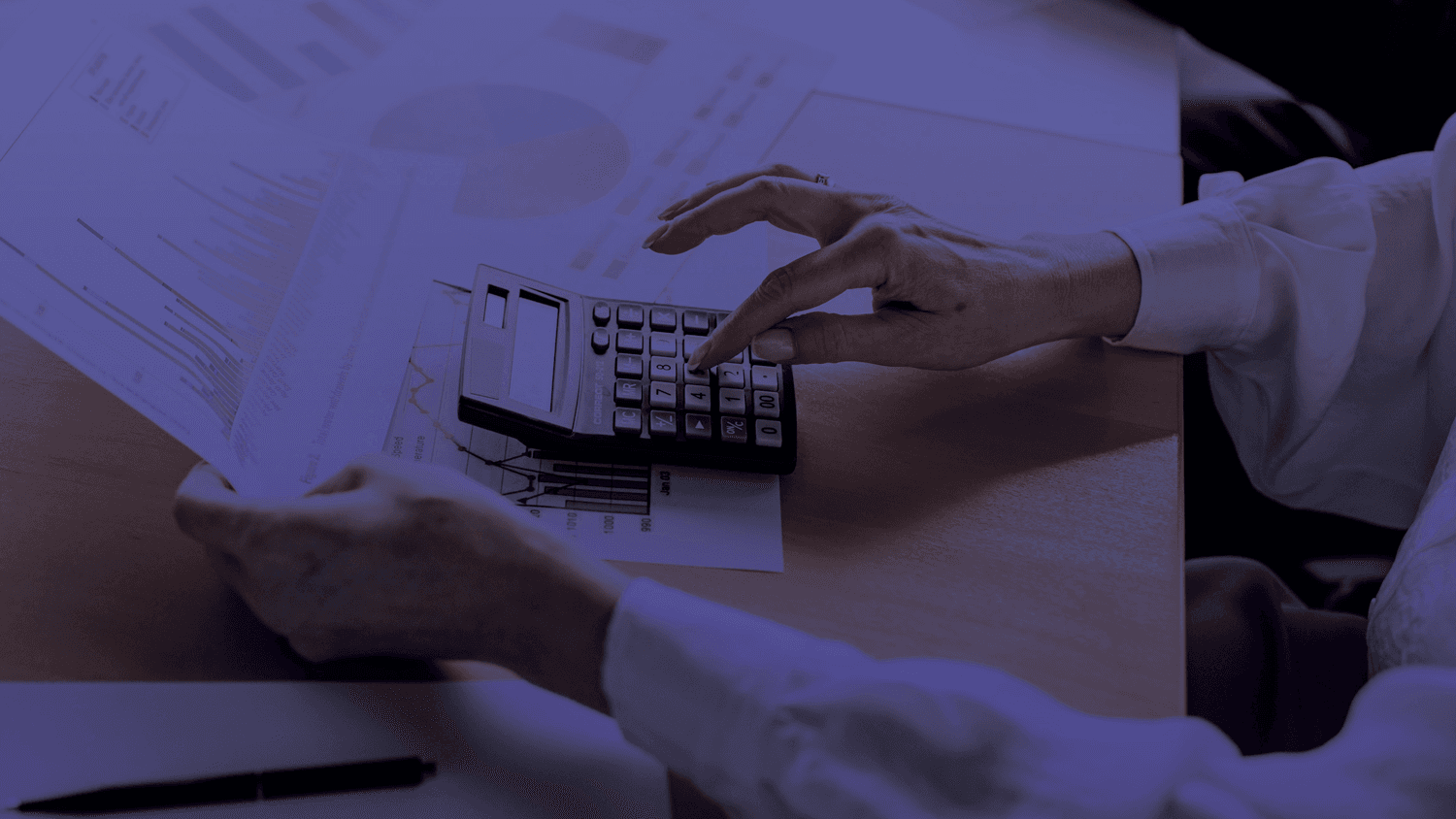 Close up of woman using a calculator